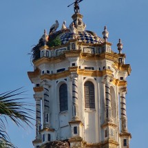 Storks on top of the church Iglesia de San Juan Baustista in La Palma del Candado